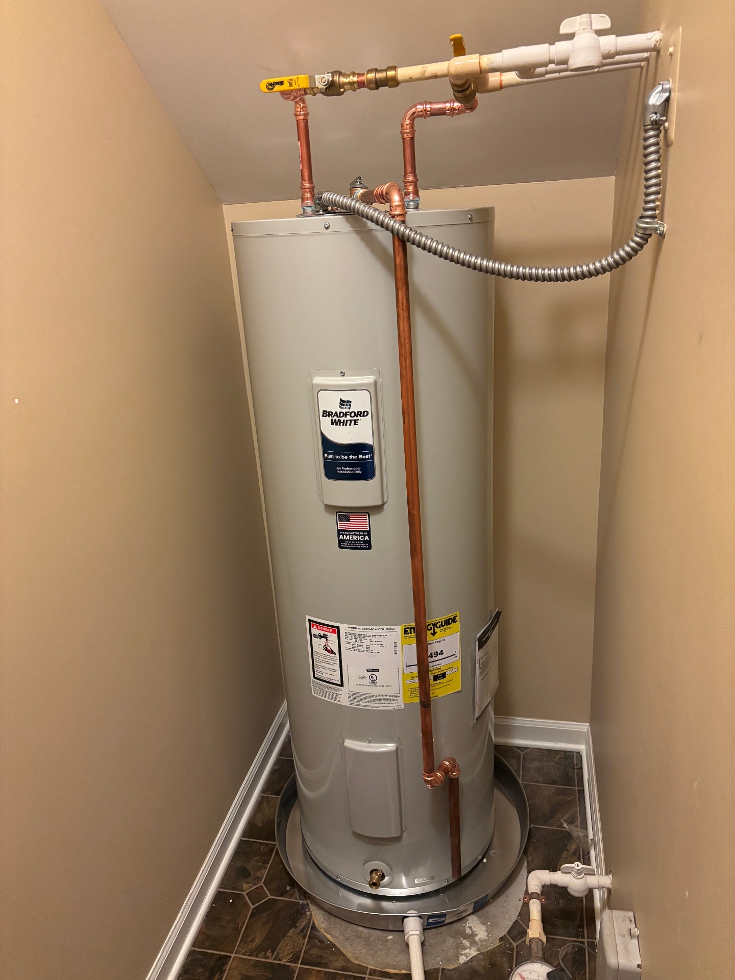 Water heater installation in a residential utility closet