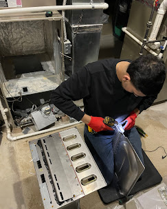 Technician working on burner